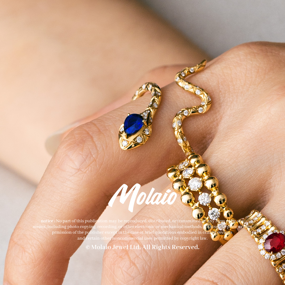 OUROBOROS Snake Winding Design Ring with 0.40 Carat Sapphire